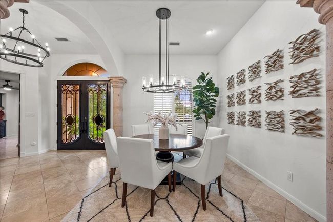 With columns and elegant archways, the formal dining room makes an unforgettable statement—perfect for entertaining with style. | Image 7