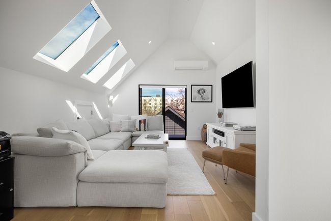 The third-floor suite that serves as a versatile live-work space with breathtaking views from its private balcony. | Image 26