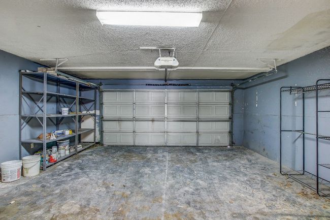 Garage with a garage door opener | Image 23