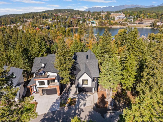 Aerial view from front of home, with Bigfork Bay and the Swan Mountains in the background | Image 60