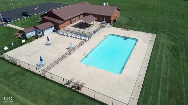 community pool featuring a patio area | Image 9