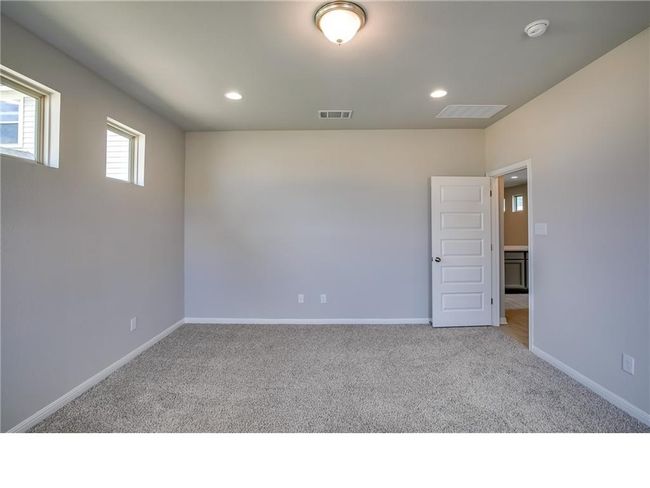 Unfurnished room with carpet flooring, a smoke detector, and recessed lighting | Image 14
