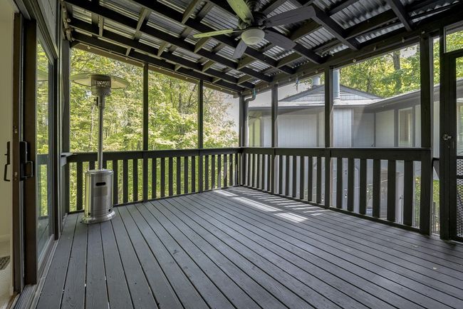 Screened in porch with access from primary bedroom and from the kitchen/dining area. | Image 32
