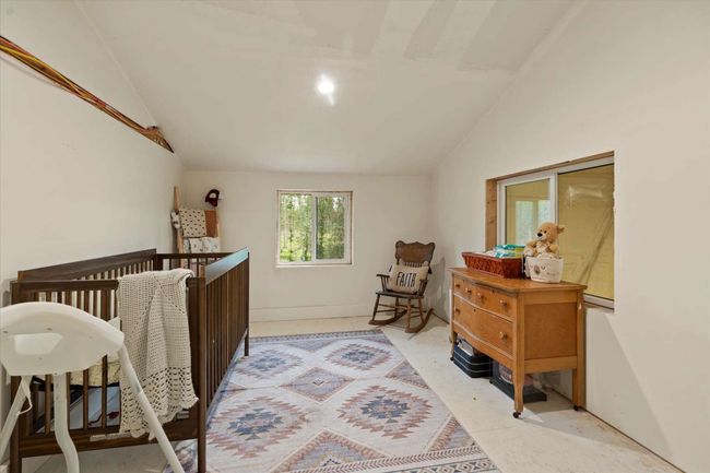 Bedroom with lofted ceiling and recessed lighting | Image 28