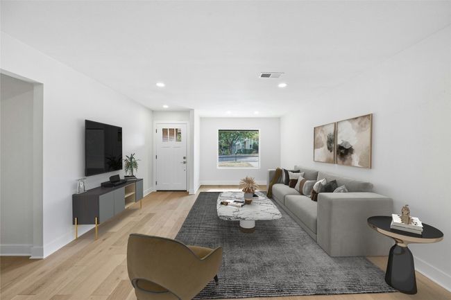 Living area with light wood-type flooring and recessed lighting | Image 5