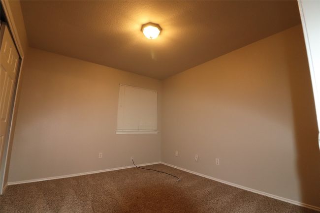 Carpeted empty room with baseboards | Image 11