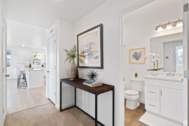 Bathroom featuring vanity and light wood-style floors | Image 24