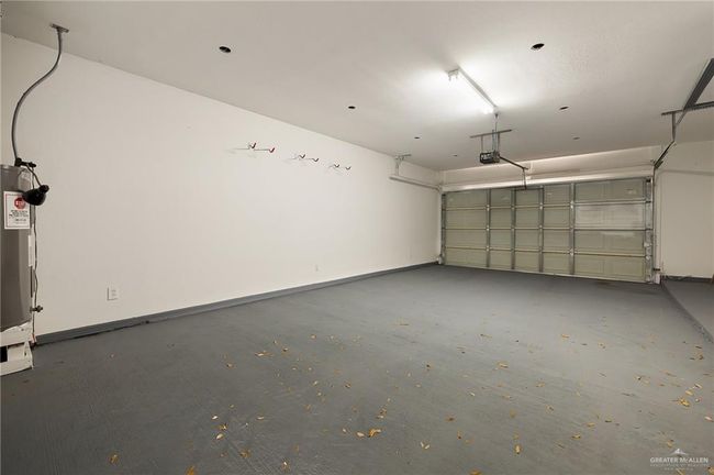 Garage with a garage door opener | Image 12