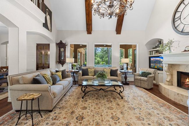 There are two gas log fireplaces inside the home. One in the den, and the other in the downstairs entertainment space. This is another photo of the den. You really need to see it in person to grasp the full beauty of the home - photos just don't do enough justice. It's a show-stopper! | Image 25