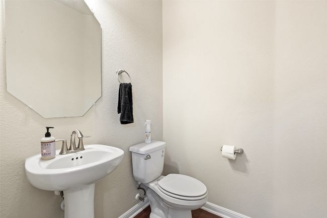 A main level powder room is convenient for guests. | Image 13