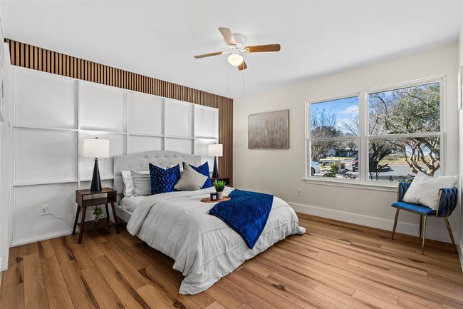 Bedroom featuring baseboards, wood finished floors, and ceiling fan | Image 20
