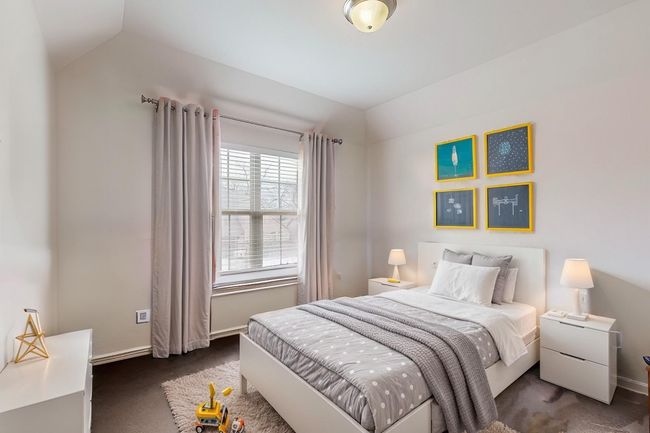 Bedroom featuring carpet floors, vaulted ceiling, and baseboards | Image 10