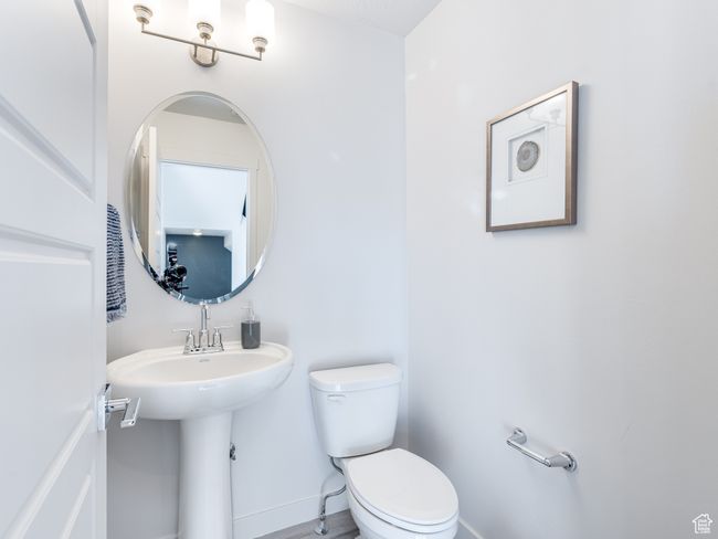 Bathroom with toilet and baseboards | Image 16