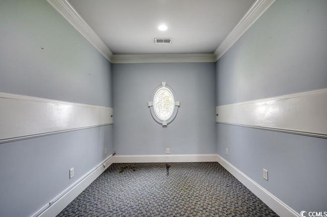 Spare room featuring crown molding, carpet, and baseboards | Image 10