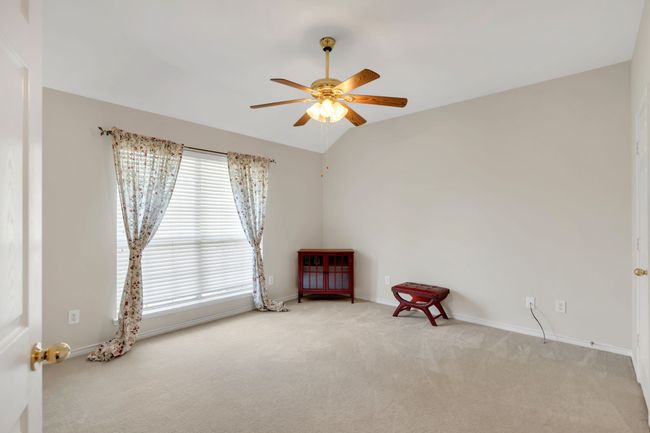 Carpeted spare room featuring baseboards and a ceiling fan | Image 29