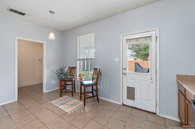 Door leads to back patio. | Image 10
