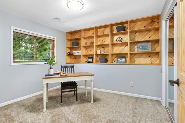 The 5th bedroom located in the Lower Level. Utilize the extra space as an office, exercise or hobby room. | Image 27