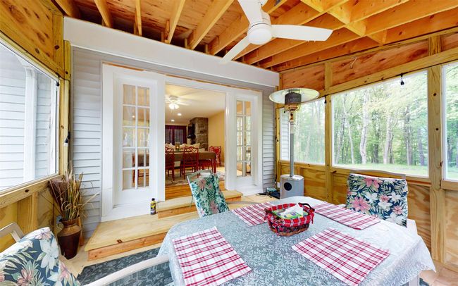 Sunroom featuring plenty of natural light and french doors | Image 18