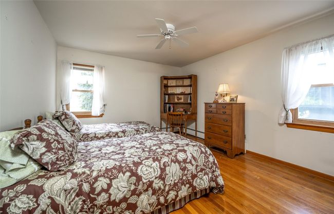 Primary Bedroom with ceiling fan, wood floors, and dbl closet | Image 7