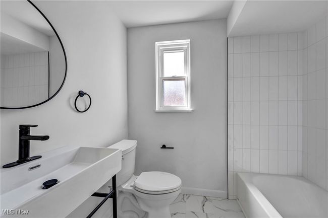 Full bathroom featuring toilet, marble finish floor, baseboards, and vanity | Image 14