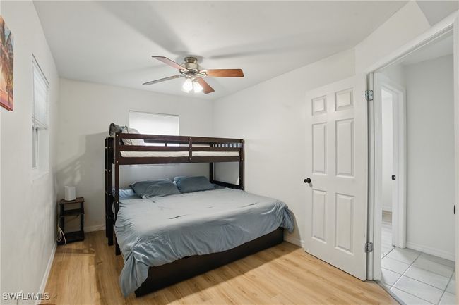 Bedroom featuring wood finished floors and a ceiling fan | Image 28