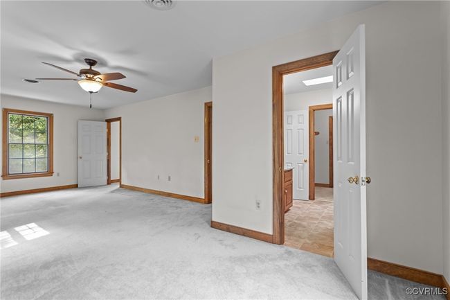Unfurnished room featuring a ceiling fan and light carpet | Image 24