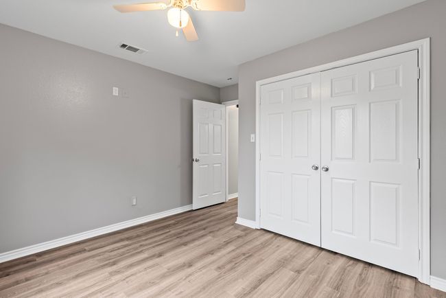 Unfurnished bedroom featuring light wood-style flooring, a closet, and ceiling fan | Image 22