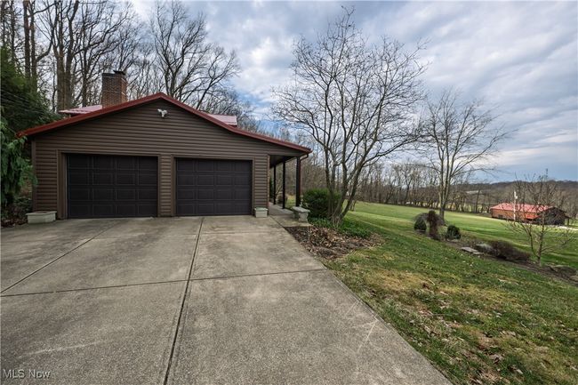 Garage featuring driveway | Image 8