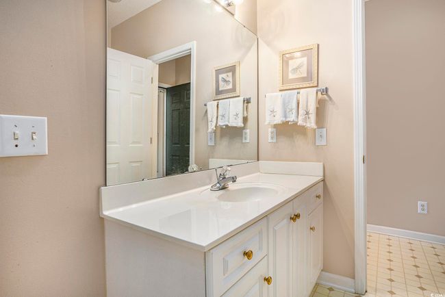 Bathroom featuring vanity and baseboards | Image 10