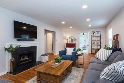 Living room featuring hardwood / wood-style flooring | Image 3