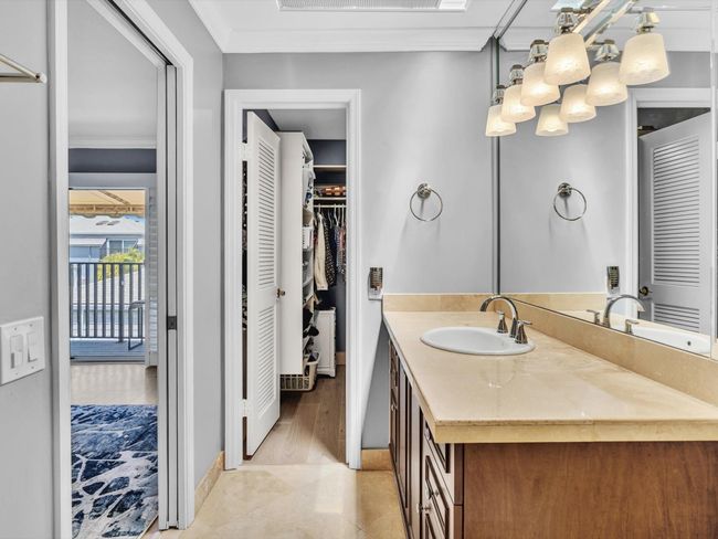 #1 main bedroom has balcony, walk in closet and large bathroom with skylight | Image 49