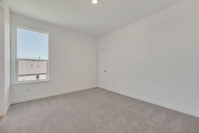 Carpeted spare room featuring baseboards | Image 8