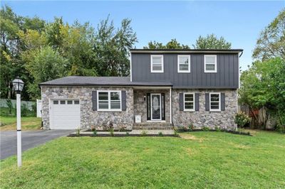 Front of property with a garage and a front yard | Image 1