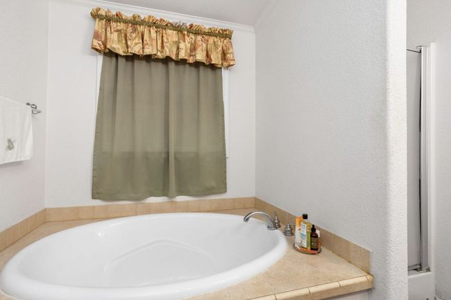 Primary bathroom with both a garden tub and walk in shower | Image 24
