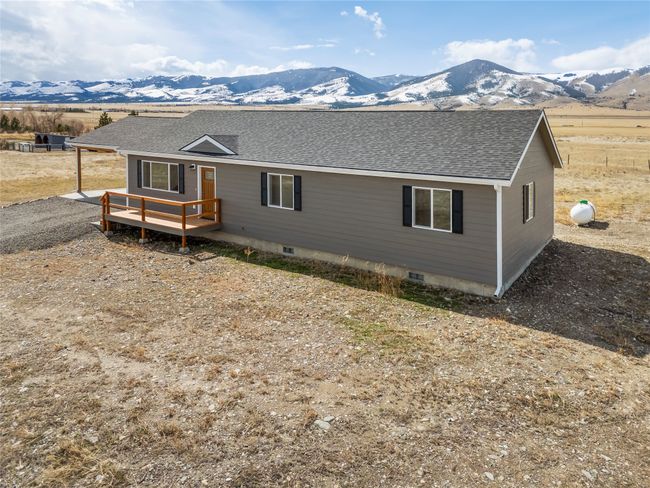 View of front of property featuring crawl space, roof with shingles, and a deck with mountain view | Image 12