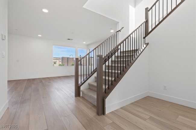 Staircase with wood finished floors, recessed lighting, and baseboards | Image 21