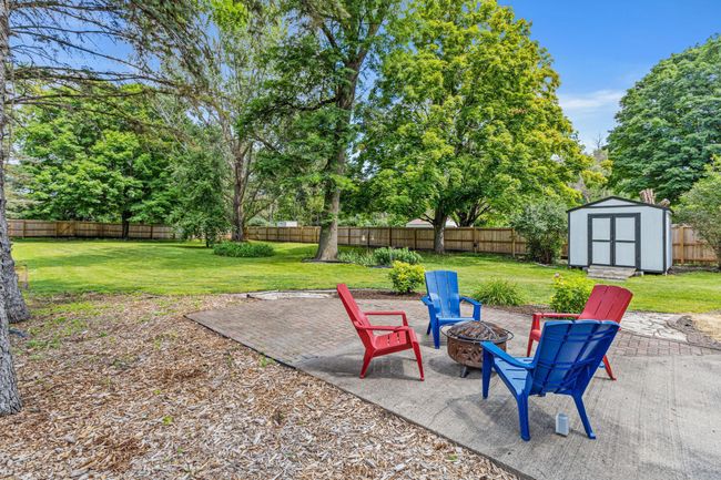 Half acre lot is fully fenced with cedar privacy fence. | Image 37