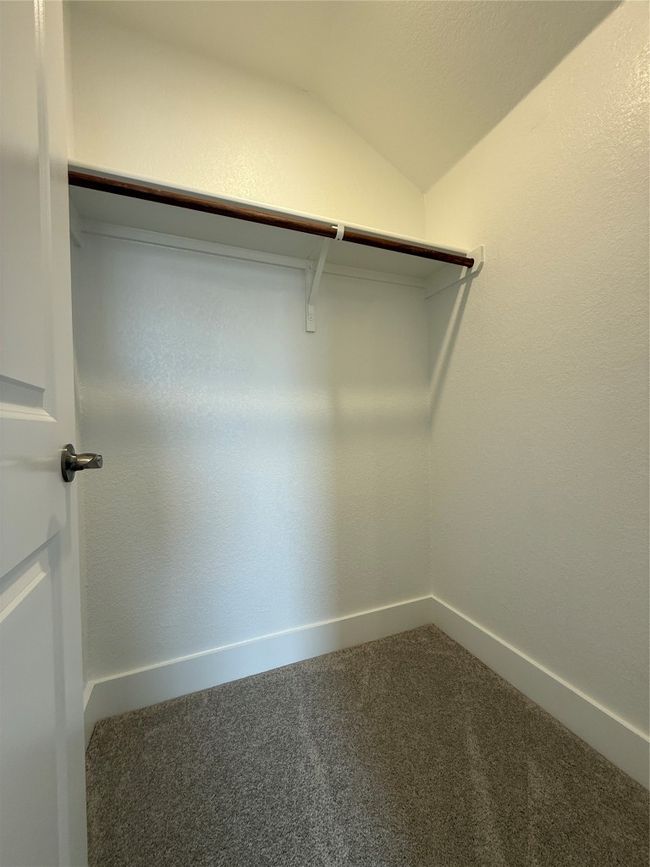 Spacious closet with carpet floors and vaulted ceiling | Image 34
