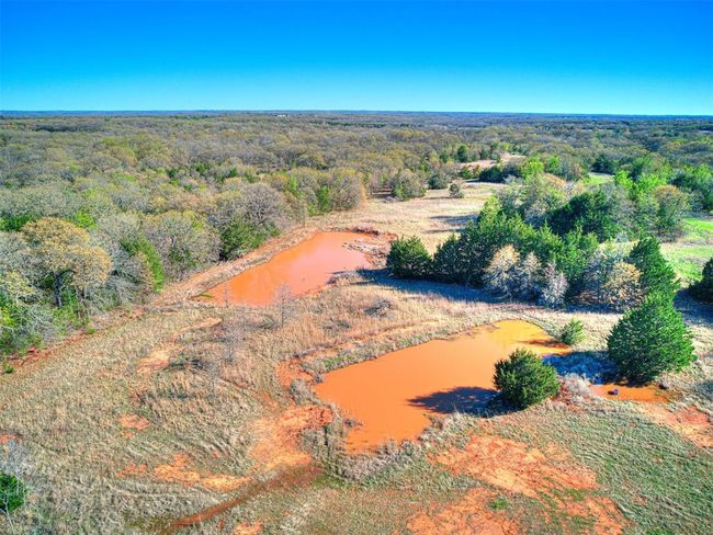 Birds eye view of property featuring a wooded view and a water view | Image 9