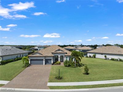 View of front of house featuring a garage and a front lawn | Image 1