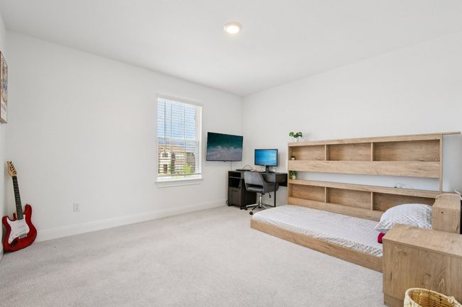 Living area featuring a desk and carpet | Image 18