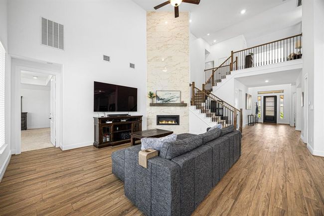 The living room allows space for multiple furniture configurations. | Image 20