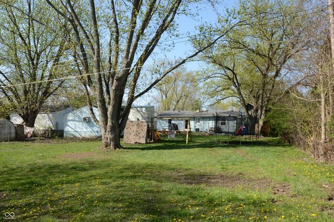 view of yard with a trampoline | Image 42