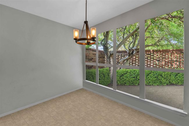 Breakfast room overlooking private front patio space. | Image 19