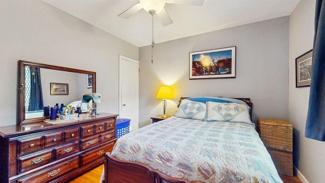 Bedroom featuring wood finished floors and a ceiling fan | Image 17