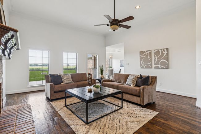 Another view of the living room with the gorgeous wood floors and lots of light | Image 9