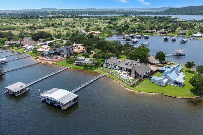 Aerial perspective of suburban area featuring a nearby body of water | Image 39