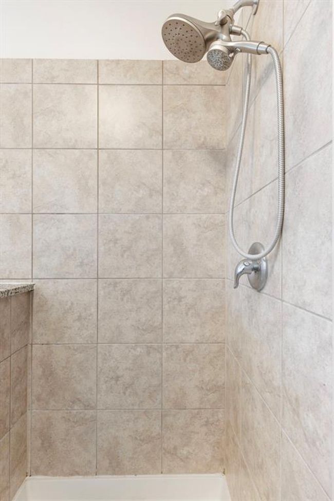You will love the tiled walk-in shower with shower wand. | Image 26