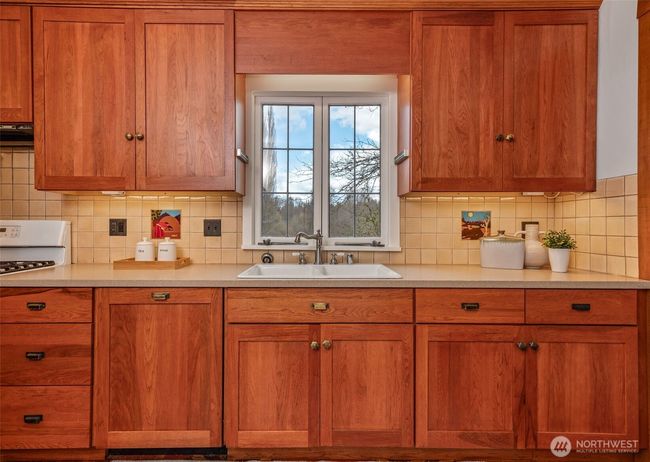 Pecan wood cabinets. | Image 8