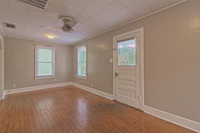 Foyer entrance with ceiling fan, hardwood / wood-style flooring, and crown molding | Image 11